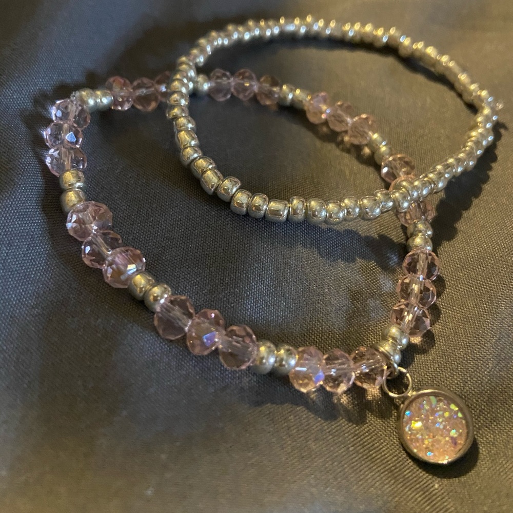 Pink and silver stretch bracelet with pink charm